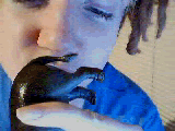 Animated gif of a teenaged me licking the butt of a hippo toy.