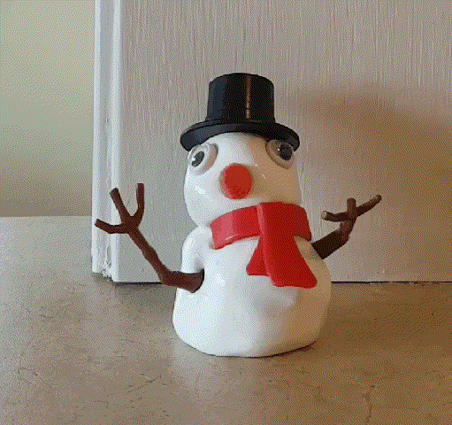 Time lapse of a snowman toy melting into a blob of accessories.