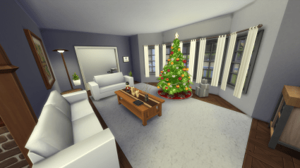 A living room with a rectangle of white carpet in the middle of wood flooring. There are two white couches flanking a long coffee table. In front of the table, before the windows is a Christmas tree.