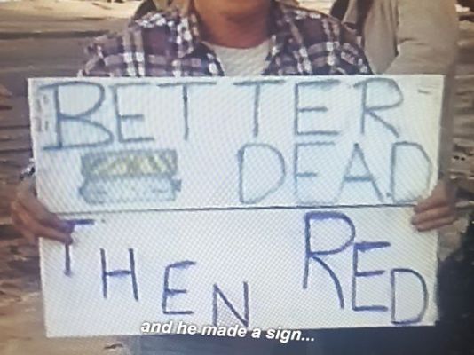 A homemade sign that says "Better Dead Then Red".