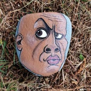 A rock painted to look like The Rock.