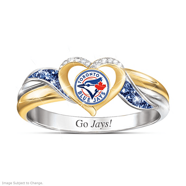 A silver and gold band with blue and white gemstones surrounding a heart that holds the Toronto Blue Jays logo.