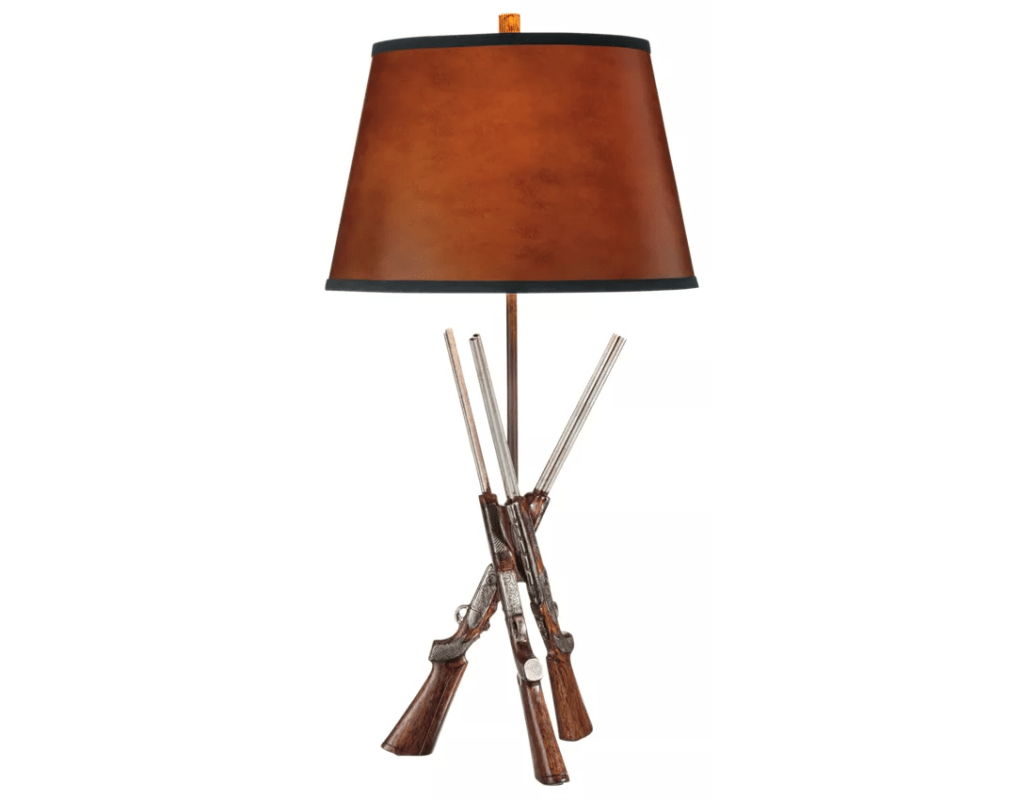 A table lamp with three shotguns as its base. 